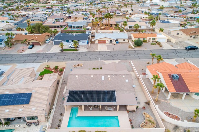 birds eye view of property with a residential view