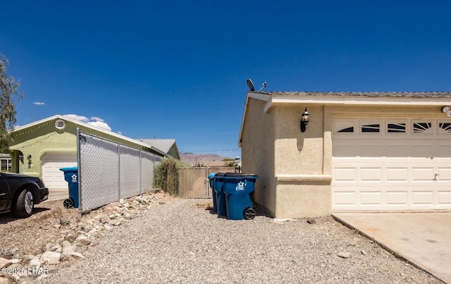 view of side of property with a garage