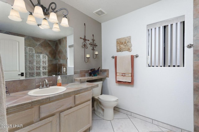 full bathroom featuring visible vents, toilet, tile patterned flooring, vanity, and a walk in shower