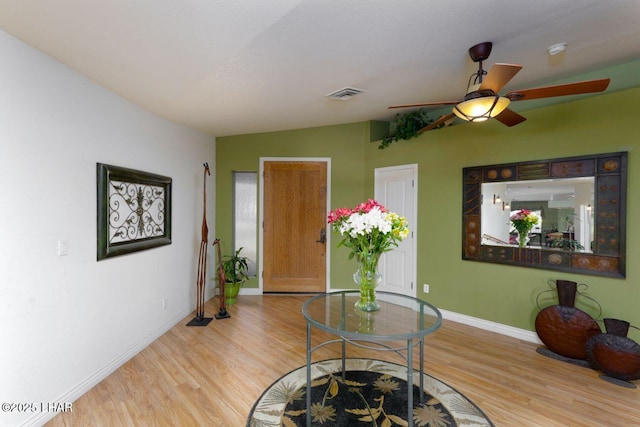 dining area featuring wood finished floors, visible vents, and baseboards