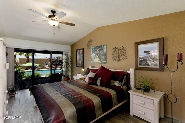 bedroom with access to outside, a ceiling fan, vaulted ceiling, and wood finished floors