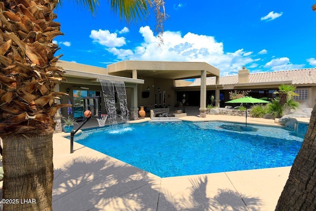 outdoor pool with a patio area