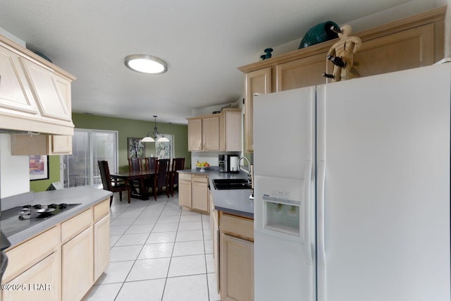 kitchen with black cooktop, light brown cabinetry, light tile patterned flooring, a sink, and white fridge with ice dispenser