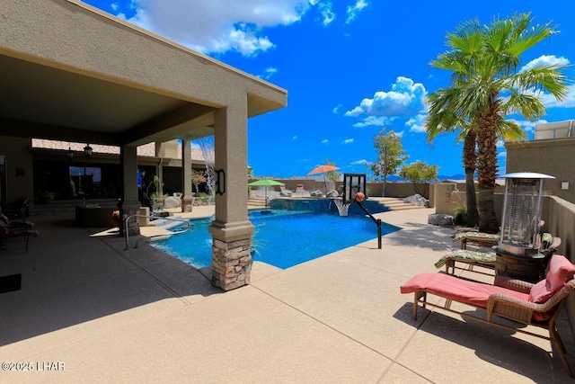 view of swimming pool with a patio, a fenced backyard, and a fenced in pool