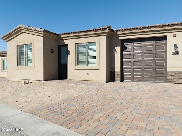 mediterranean / spanish-style house featuring a garage