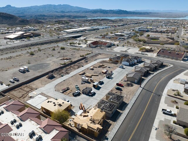 birds eye view of property featuring a mountain view