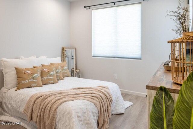 bedroom with light wood-type flooring