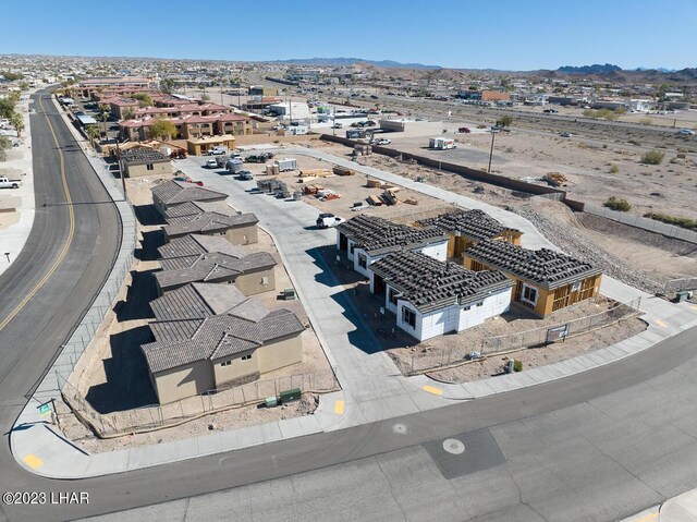 birds eye view of property featuring a mountain view