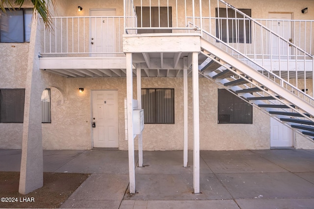 entrance to property with a balcony