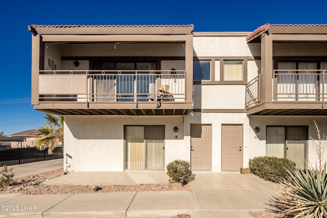 view of front of house with a balcony