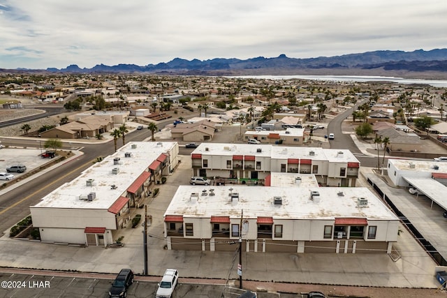 birds eye view of property with a mountain view