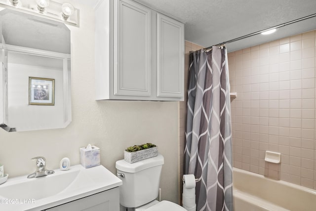 full bathroom with toilet, vanity, shower / tub combo with curtain, and a textured ceiling