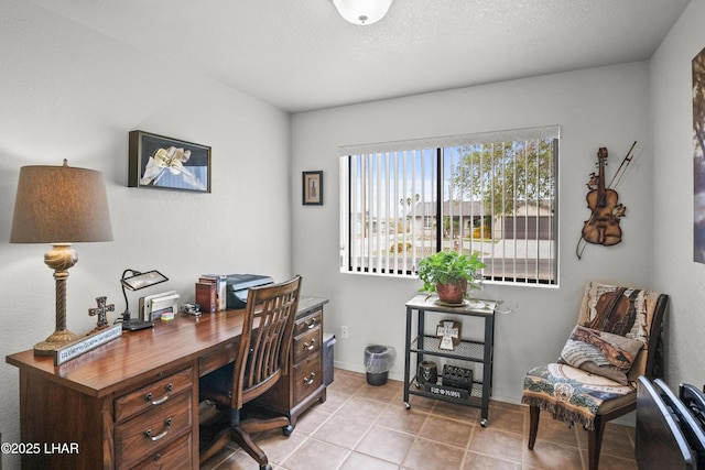 office space featuring baseboards and light tile patterned flooring