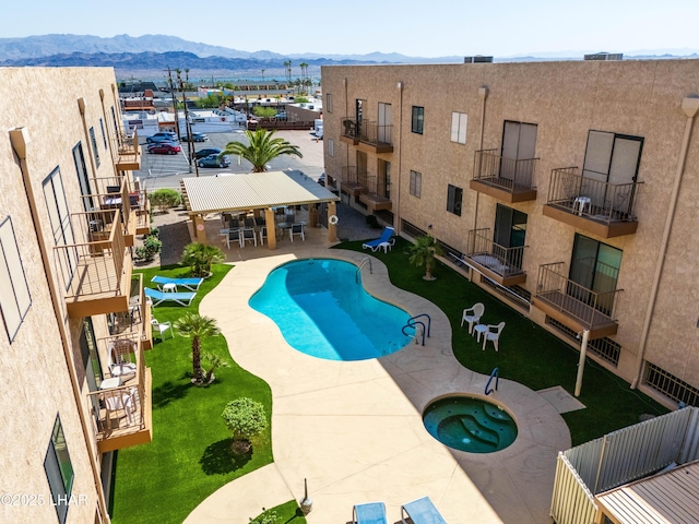 2094 Mesquite Ave Unit 113, Lake Havasu City, AZ 86403 - community pool with a community hot tub, a mountain view, and a patio