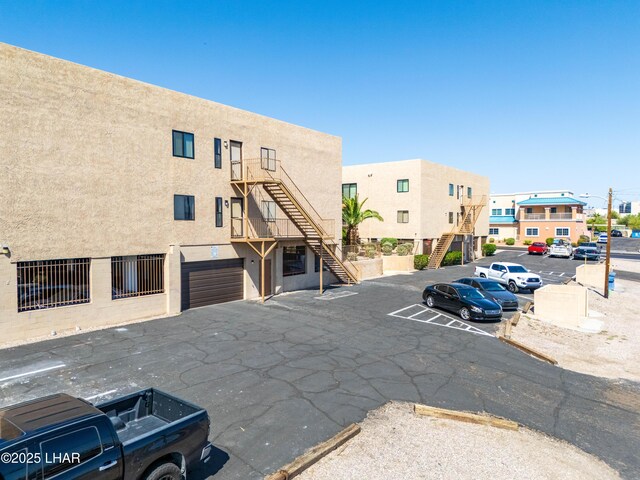 2094 Mesquite Ave Unit 113, Lake Havasu City, AZ 86403 - view of building exterior featuring stairway and uncovered parking