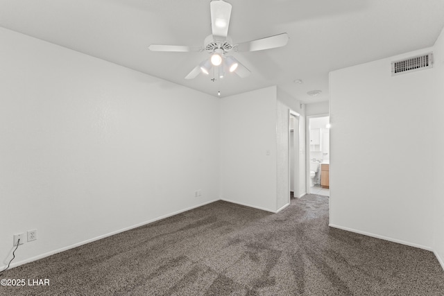 2094 Mesquite Ave Unit 113, Lake Havasu City, AZ 86403 - spare room featuring dark colored carpet and a ceiling fan