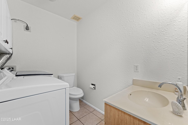 2094 Mesquite Ave Unit 113, Lake Havasu City, AZ 86403 - bathroom featuring vanity, tile patterned flooring, and washer and dryer