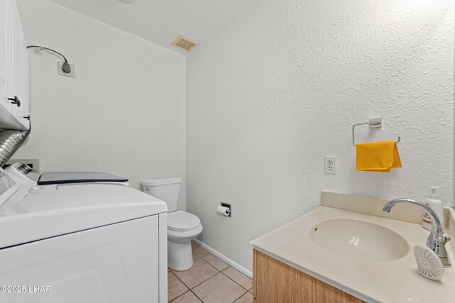 2094 Mesquite Ave Unit 113, Lake Havasu City, AZ 86403 - bathroom with vanity, tile patterned flooring, and washing machine and clothes dryer
