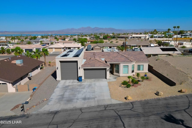 2969 Pony Cir, Lake Havasu City, AZ 86406 - view of front facade with a residential view, stucco siding, a tiled roof, a garage, and driveway