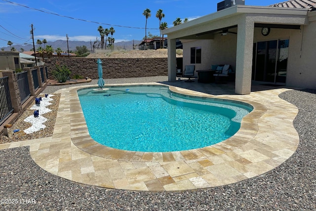 2969 Pony Cir, Lake Havasu City, AZ 86406 - view of pool featuring a patio, a fenced backyard, a ceiling fan, and a mountain view