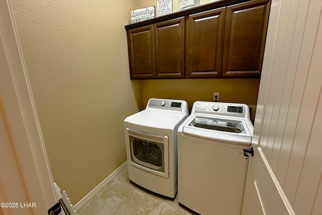 2969 Pony Cir, Lake Havasu City, AZ 86406 - washroom with washing machine and clothes dryer, cabinet space, and light tile patterned floors