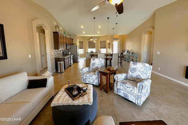 2969 Pony Cir, Lake Havasu City, AZ 86406 - living room with arched walkways, ceiling fan, light tile patterned flooring, and recessed lighting