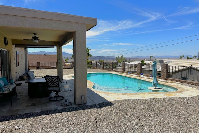 2969 Pony Cir, Lake Havasu City, AZ 86406 - view of pool with ceiling fan, a fenced backyard, a mountain view, and a patio area