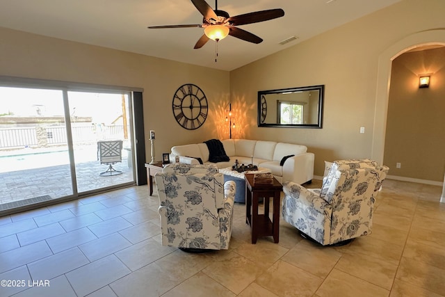 2969 Pony Cir, Lake Havasu City, AZ 86406 - living area featuring arched walkways, ceiling fan, lofted ceiling, and light tile patterned floors