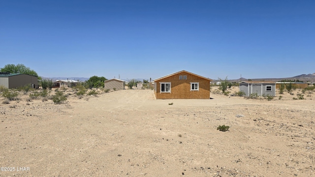 16457 S Lynn Ave, Yucca, AZ 86438 - back of house featuring an outbuilding