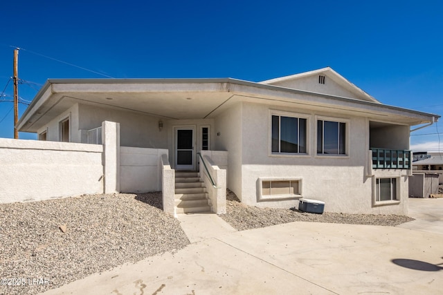 view of front of home featuring stucco siding