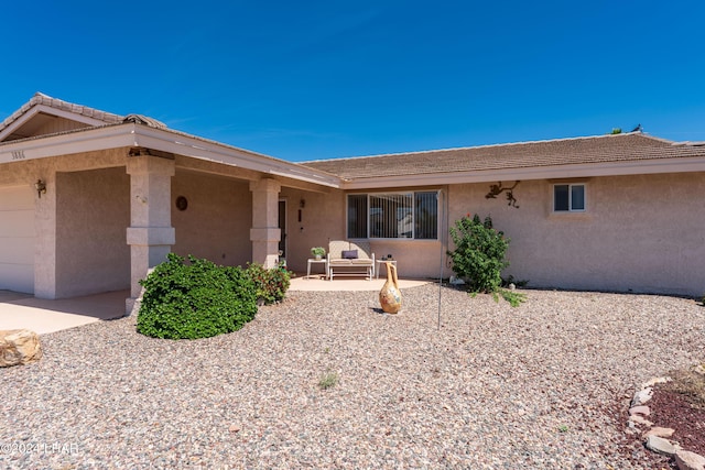 ranch-style home with stucco siding