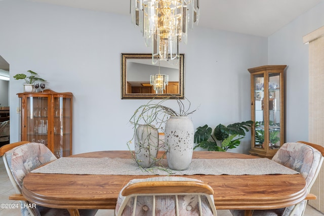 dining area with an inviting chandelier