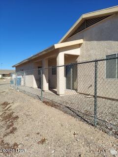 view of property exterior featuring fence