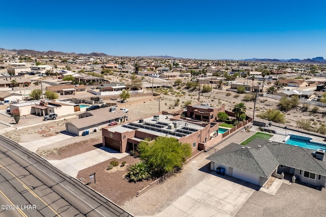 birds eye view of property with a mountain view