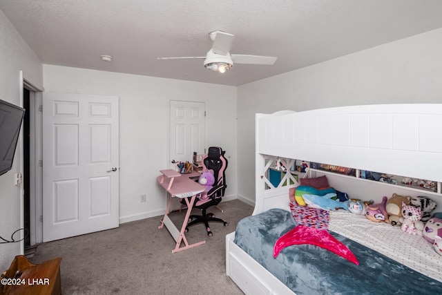 bedroom featuring a textured ceiling, ceiling fan, and carpet flooring