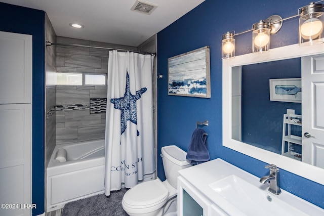 full bathroom with toilet, vanity, and shower / bath combo with shower curtain