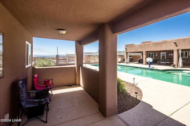 view of swimming pool with a patio area