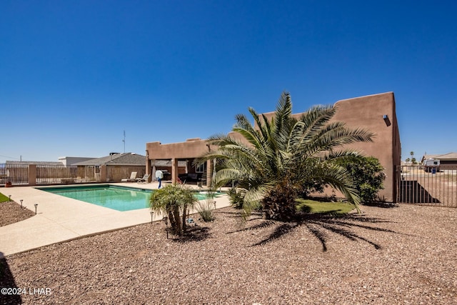 view of swimming pool featuring a patio area