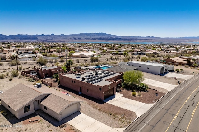 birds eye view of property featuring a mountain view