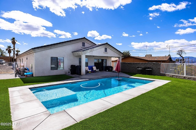 view of pool featuring a fenced backyard, a patio, and a yard