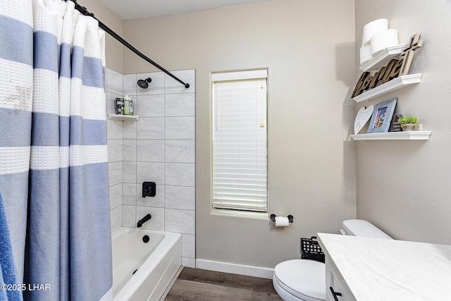 full bathroom with toilet, wood finished floors, vanity, baseboards, and shower / tub combo with curtain