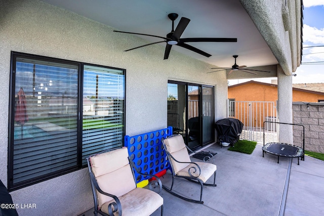 view of patio / terrace featuring ceiling fan, grilling area, and fence