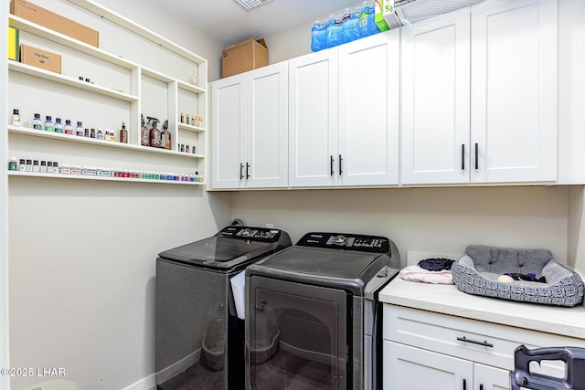 laundry room featuring cabinet space and washing machine and clothes dryer