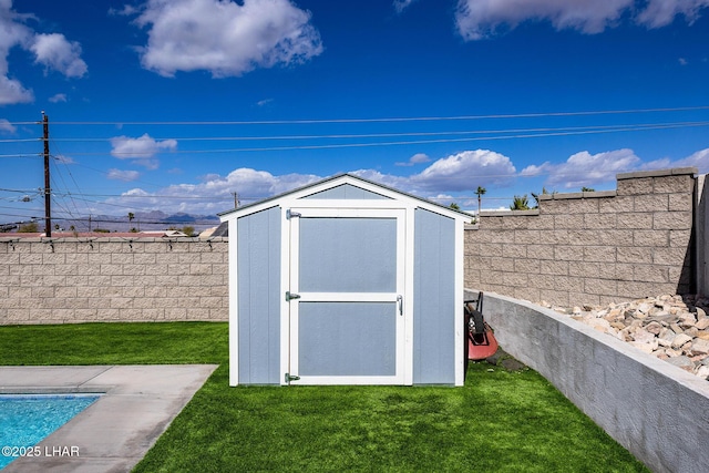 view of shed featuring a fenced backyard