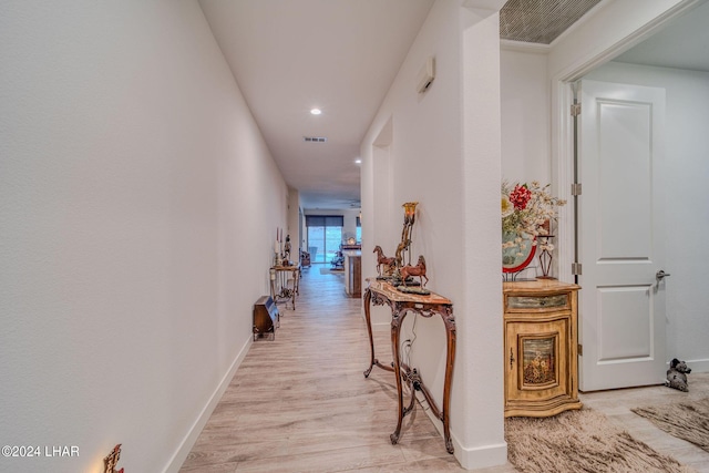 corridor featuring light hardwood / wood-style flooring