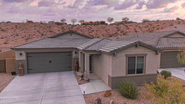 ranch-style home with a garage