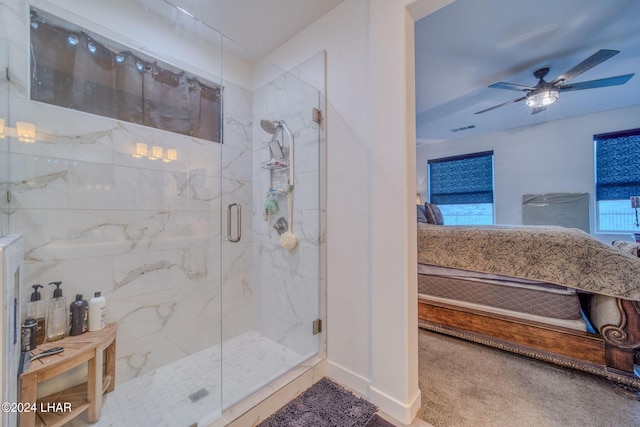 bathroom featuring an enclosed shower and ceiling fan