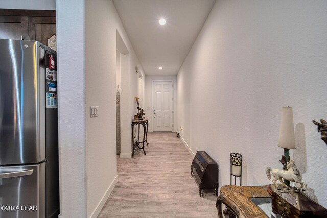 corridor with light wood-type flooring