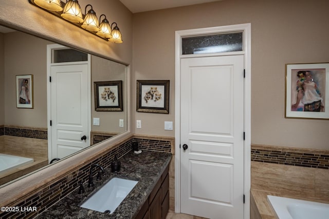 1415 Mcculloch Blvd N Unit 102, Lake Havasu City, AZ 86403 - bathroom featuring tile walls, a bath, and vanity