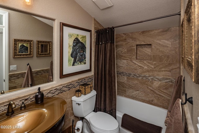1415 Mcculloch Blvd N Unit 102, Lake Havasu City, AZ 86403 - full bathroom featuring shower / bath combo with shower curtain, vanity, toilet, tile walls, and a textured ceiling
